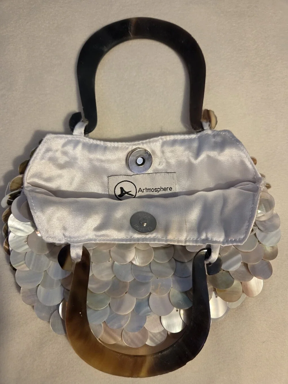 Elegant Iridescent Abalone Shell Disc Handbag with Dark Handle